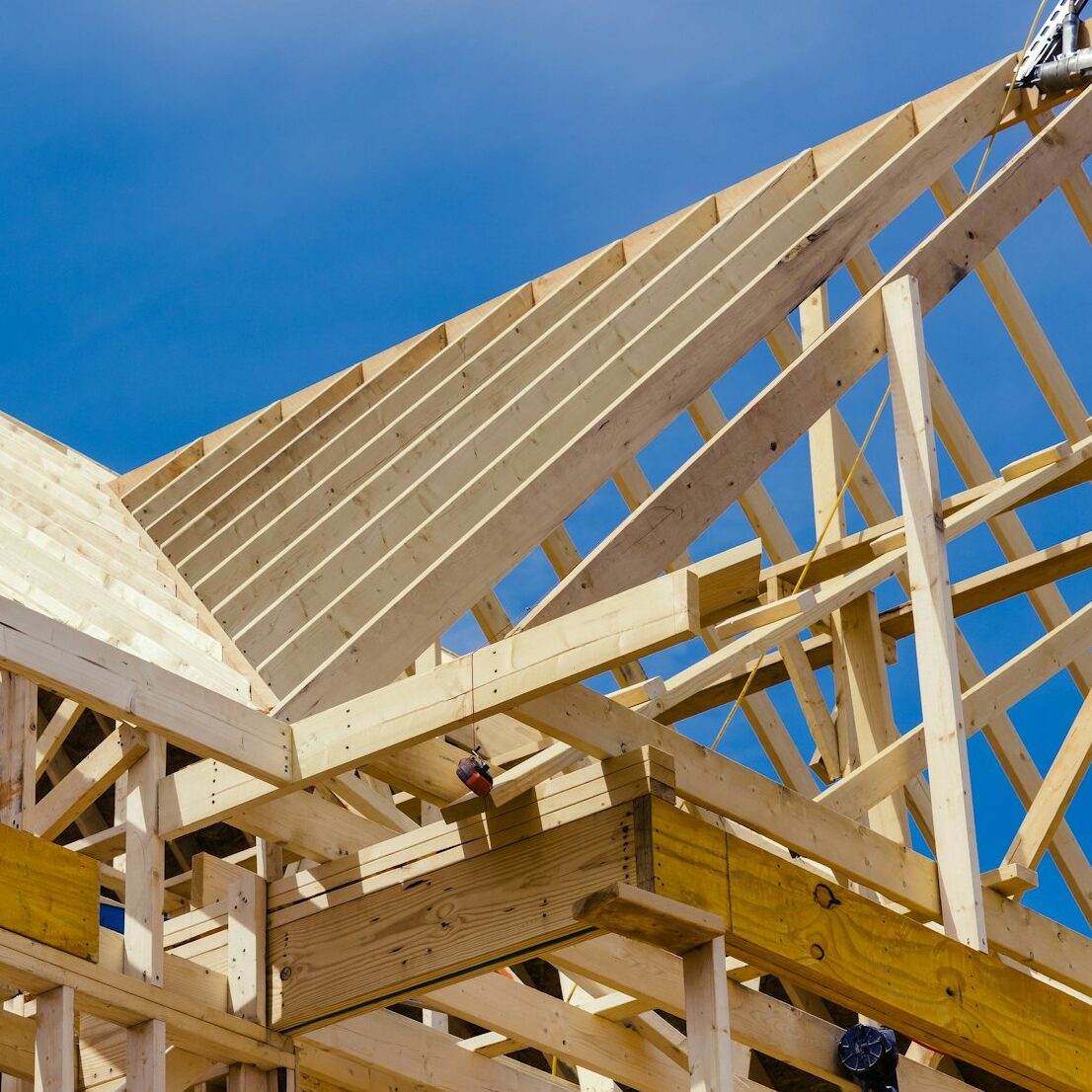 New residential construction home framing with a roof view